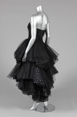 Lot 19 - A black tulle and beaded cocktail dress, 1980s,...