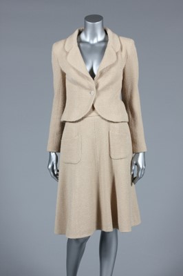 Lot 24 - A Chanel beige wool suit, circa 2002, labelled...