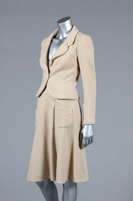 Lot 24 - A Chanel beige wool suit, circa 2002, labelled...