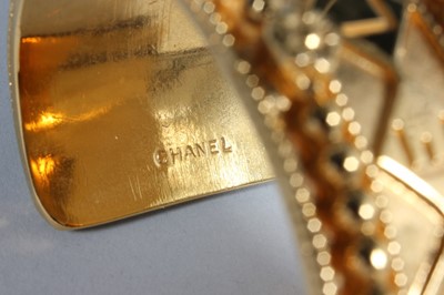 Lot 28 - A Chanel gilt bangle, 1980s, marked Chanel,...