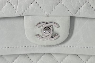 Lot 22 - A Chanel eau-de-nil quilted leather double...