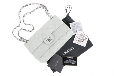 Lot 22 - A Chanel eau-de-nil quilted leather double...