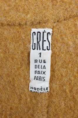 Lot 136 - A Madame Grès mustard wool coat, probably...