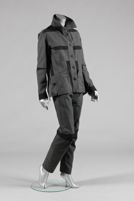 Lot 167 - An Issey Miyake panelled cotton 'combat' suit,...