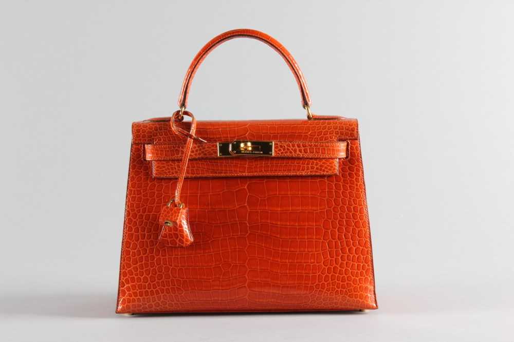 Click for high resolution Lot 13 - A fine Hermès orange crocodile Kelly bag, 1995,...