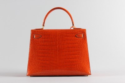 Lot 13 - A fine Hermès orange crocodile Kelly bag, 1995,...