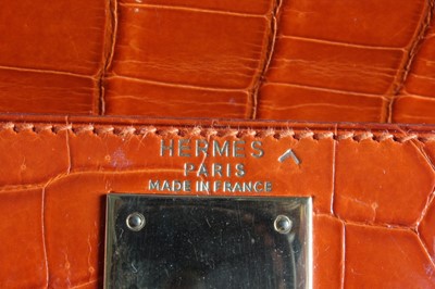 Lot 13 - A fine Hermès orange crocodile Kelly bag, 1995,...