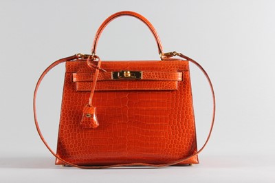 Lot 13 - A fine Hermès orange crocodile Kelly bag, 1995,...