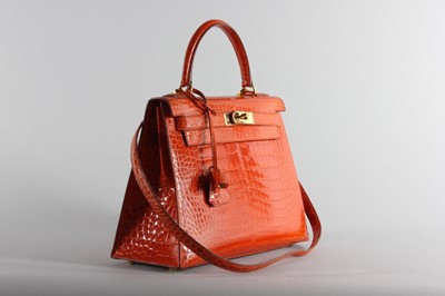 Lot 13 - A fine Hermès orange crocodile Kelly bag, 1995,...