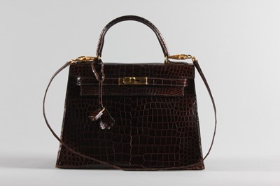 Lot 14 - An Hermès brown crocodile Kelly bag, 1974,...