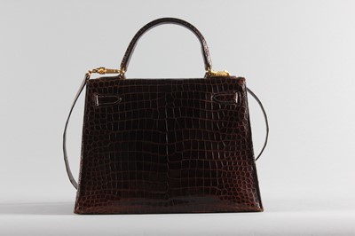Lot 14 - An Hermès brown crocodile Kelly bag, 1974,...