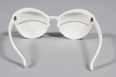 Lot 26 - A pair of Courrges white plastic sunglasses,...
