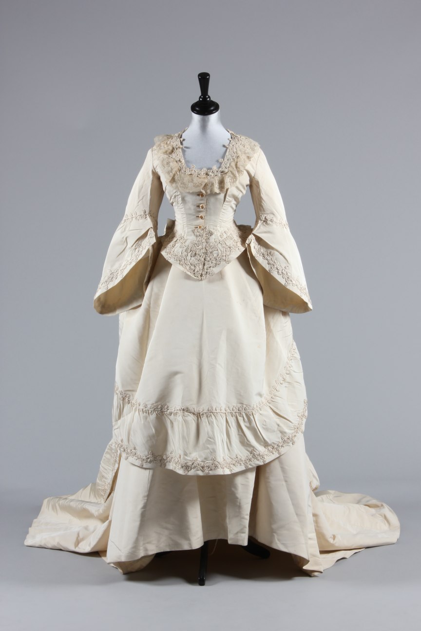 Lot 34 - An ivory silk faille bridal gown, circa 1871,