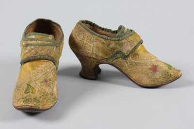 Lot 19 - A pair of yellow brocaded satin shoes, 1730s,...