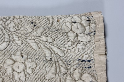 Lot 30 - A quilted ivory satin petticoat, second half...