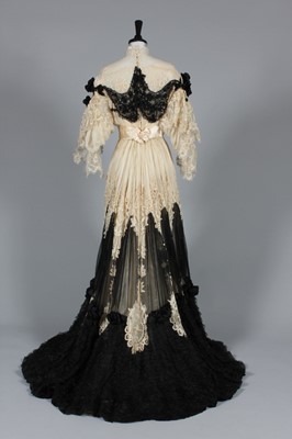 Lot 41 - An ivory tapelace and black chiffon evening...