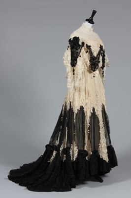 Lot 41 - An ivory tapelace and black chiffon evening...