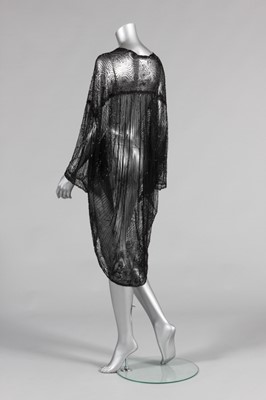 Lot 45 - A black beaded tulle opera coat, mid 1920s,...