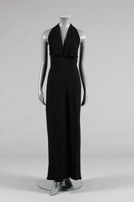 Lot 61 - A Lucien Lelong black silk crêpe evening gown...