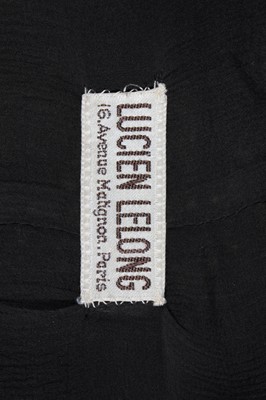 Lot 61 - A Lucien Lelong black silk crêpe evening gown...