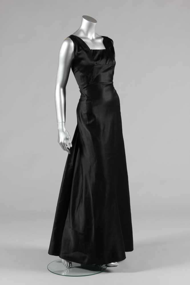 Lot 56 - A Daphne black satin couture evening gown,...