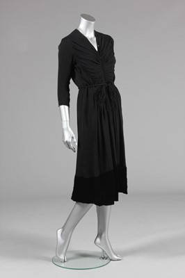 Lot 67 - A rare Lucien Lelong black crpe dinner dress,...