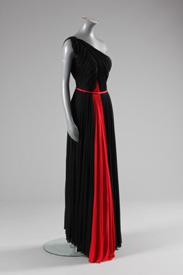 Lot 72 - A Madame Grès couture asymmetric draped black...