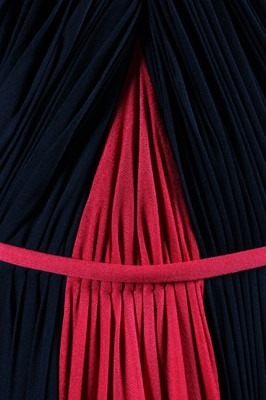 Lot 72 - A Madame Grès couture asymmetric draped black...