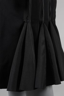 Lot 94 - A Jacques Fath black wool dinner dress, Autumn-...