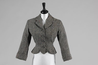 Lot 93 - A Paquin flecked tweed jacket, 1954, woven...