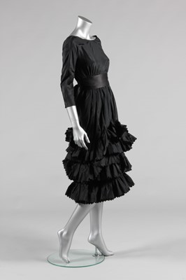 Lot 127 - A black taffeta cocktail dress, late 1950s or...