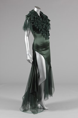 Lot 184 - An Alexander McQueen green stretch satin and...