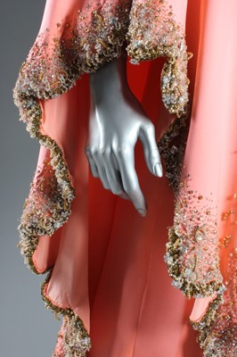 Lot 116 - A Valentino couture salmon-pink crêpe evening...