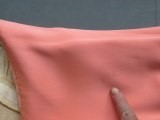 Lot 116 - A Valentino couture salmon-pink crêpe evening...