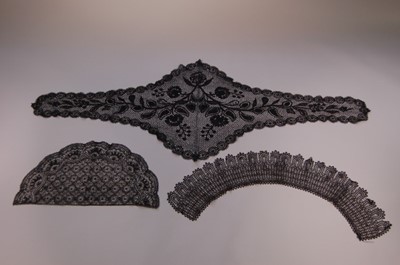 Lot 210 - A group of black bobbin lace, mainly Le Puy,...