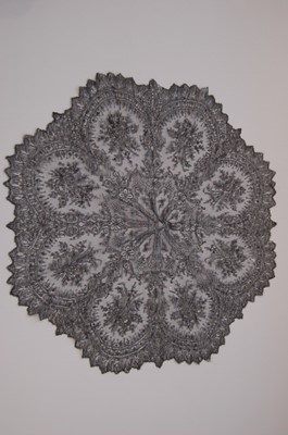 Lot 214 - A black Chantilly parasol cover, circa 1860,...