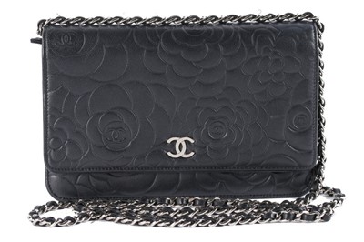 Lot 24 - A Chanel WOC of camellia-embossed black...
