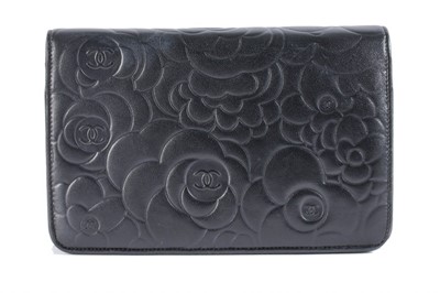 Lot 24 - A Chanel WOC of camellia-embossed black...