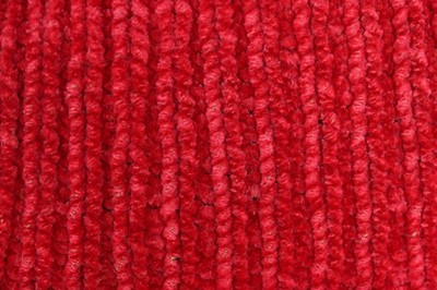 Lot 95 - A rare raspberry chenille girl's muff, late...