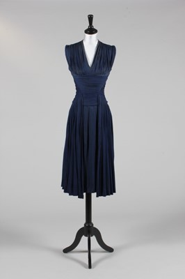 Lot 134 - A midnight blue draped jersey dinner dress,...