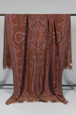 Lot 332 - A woven Paisley design woollen shawl, probably...