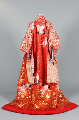 Lot 173 - A richly brocaded red silk marriage kimono,...