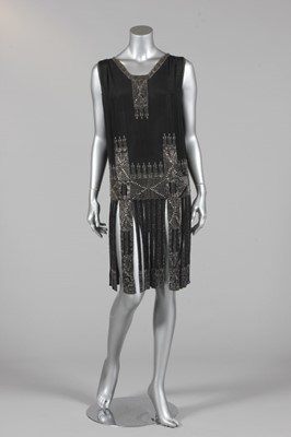 Lot 296 - A beaded black crepe de chine flapper dress,...