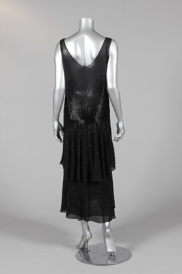 Lot 299 - A good beaded black chiffon cocktail dress,...