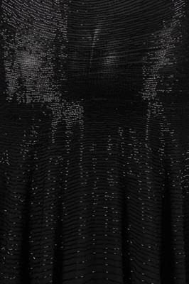 Lot 299 - A good beaded black chiffon cocktail dress,...