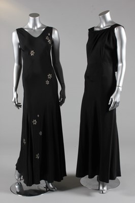 Lot 302 - A black crepe bias cut evening gown with...