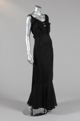 Lot 303 - A black chiffon evening gown, circa 1935, with...