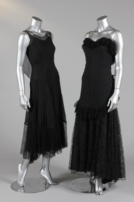 Lot 306 - A black chiffon and lace evening gown with...