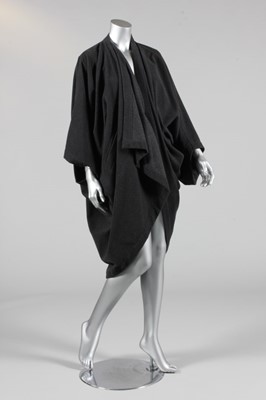 Lot 315 - An Issey Miyake charcoal grey wool cocoon coat,...