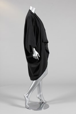 Lot 315 - An Issey Miyake charcoal grey wool cocoon coat,...